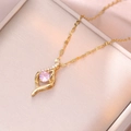 Golden clover pendant necklace with pink crystal and zircon on elegant wave chain - Gold
