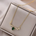 Golden reindeer necklace with a green pear-shaped gemstone and crystal accents - Gold Antler (X0123) / Gold Necklace