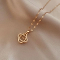 Elegant rose gold necklace featuring interlocking rings with micro-set zircon stones - Double Intertwined Hollow Rings Style (X0364)
