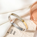 Macro detail of two-tone titanium steel bangle with eight square-cut gemstones and beading - Silver Mirror Gold Decor Style / Two-tone (Gold & Silver)