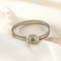 Detail of geometric silver bangle with emerald stone and Greek meander pattern - Steel Color (SZ110090)