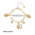 Macro detail of golden stainless steel bracelet featuring sacred heart charms and lobster clasp - Sacred Heart Gold Style (SL110023 Gold)