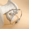 Elegant silver-toned spring cuff bracelet with polished and glitter beads on a pedestal - Steel Color Style (SZ-002-2)