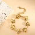 Detailed close-up of golden stainless steel heart charms and adjustable tail chain - Heart (SL-002) / Gold
