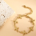 Detail of gold stainless steel bracelet showing 3D cross charms and S.Steel hallmark tag - Cross Texture (SL-011) / Gold