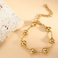 Detail of golden stainless steel teardrop bracelet with adjustable chain and logo tag - Teardrop (SL-012) / Gold