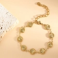 Detail of gold-plated stainless steel bracelet with spiral textured circular discs - Spiral (SL-019) / Gold