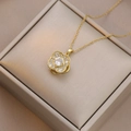 Golden flower necklace with micro-paved zircon pendant on a textured jewelry box - Necklace / Four-Petal Flower Style (X3144)