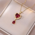 Elegant gold necklace set with red heart zircon and teardrop pendant in a jewelry box - Heart Necklace (X1911)