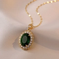 Vintage style golden necklace featuring an oval emerald green stone and zircon halo - Emerald Green (X1053)