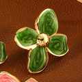 Macro detail of four-leaf clover stud earring with green enamel and gold-plated finish - Green