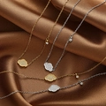Detail of minimalist gold and silver titanium necklaces with zircon cloud pendants - Ruyi Cloud Style (AL-0827) / Gold