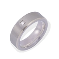 Detail of silver titanium ring with brushed metal texture and a small square set zircon - US 6 / Silver