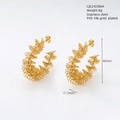 Macro detail of irregular spiral earrings in 18k PVD gold-plated stainless steel - Abstract Spiral Winding Gold Style (386)