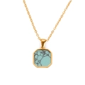 Macro shot of gold octagonal necklace pendant with turquoise stone and fine chain - Turquoise Color Style (E713-Gold+Cross Chain)