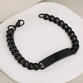 Black stainless steel Cuban link bracelet with a blank polished ID tag on a white tray - Black