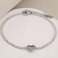 Élégant bracelet tennis en acier inoxydable avec breloque cœur et fermoir mousqueton réglable - Couleur Argent Pierre Blanche