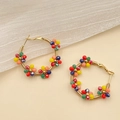 Bohemian colorful handmade beaded hoop earrings with gold floral crystal details - Multicolor