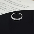 Macro detail of silver adjustable star ring with zircon stone on reflective surface - Rhombus Star Single Diamond Texture Style (JZ2441A)