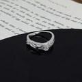 Detail of silver star ring featuring four sparkling zircons on a black reflective surface - Star Meteor Round Cut Style (JZ5516A)