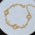 Elegante bracciale a quadrifoglio dorato con zirconi bianchi e chiusura a moschettone - Stile Fiore Quadrifoglio Traforato (SL0538)