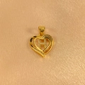 Detailed macro shot of a heart-shaped golden pendant featuring a crystal-studded letter H - Letter H Pendant Only (Without Chain)