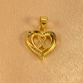 Macro shot of gold heart pendant featuring a sparkling diamond-set letter X detail - Letter X Pendant Only (Without Chain)