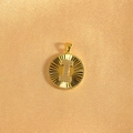 Macro shot of gold-plated sunburst pendant featuring crystal-encrusted letter I - Letter I / Gold