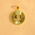 Macro shot of gold sunburst pendant with letter J and micro-paved sparkling crystals - Letter J / Gold
