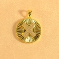 Macro detail of gold-plated sunburst pendant with crystal-encrusted center and radial lines - Letter X / Gold
