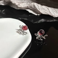 Detailed macro view of silver rabbit stud earring with round red gemstone inlay - Deep Red (JZ2167)
