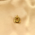 Polished gold bubble initial charm with smooth metallic finish on champagne silk background - Letter O / Gold