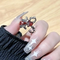 Detail of silver bow ring with heart ruby and pavé diamonds on woman hand - Adjustable Open