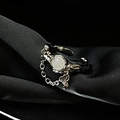 Detail of vintage gothic moonstone ring with chain on black silk fabric - Moonstone Chain Style (JZ0626)
