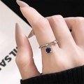 Macro shot of silver safety pin ring featuring a square blue gemstone and white zircon - Pin Paperclip Style (JZ4823)