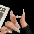 Close-up of elegant silver ring with oval clear gemstone and pavé diamonds on finger - Adjustable Open / Oval Pavé Accent Texture Style (JZ4973) / Silver