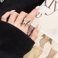 Detail of a black and white butterfly open ring with silver metal and zircon on finger - Adjustable Open / Black White Enamel Butterfly Style (JZ5374)