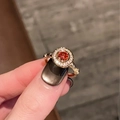 Detailed macro view of an orange gemstone ring with bamboo design and pave setting - Bamboo Grain Orange Ruby (JZ5536)