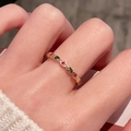 Macro detail of a gold thin ring set with red and green marquise zircons on fingers - Red And Green Gemstone Row Style (JZ5449)