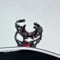 Macro shot of dark gothic black alloy ring with blood red crescent moon and bone texture - Withered Wood Texture Red Moon Style (JZ4555)