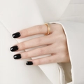 Eternity gold ring with square cubic zirconia diamonds worn on hand with white blazer - Single Row Gold