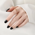 Elegant rose gold titanium ring with circular zircons on model with black nails - Single Row Rose Gold
