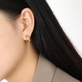 Gold eight-pointed star earrings with colorful cubic zirconia worn by model - Gold Style