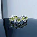Macro shot of silver ring with green enamel clovers and sparkling cubic zirconia stones - Adjustable Open / Green Clover Style (JZ1021A)