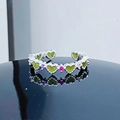 Close-up of adjustable silver ring with green heart-shaped gems and pink zircon accents - Adjustable Open / Heart Green Gem Alignment Style (JZ2391A)
