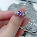 Macro shot of a heart-shaped purple gemstone ring with wavy open band and small diamonds - Heart Hollow Pavé Style (JZ6246)