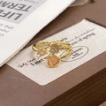 Close-up of gold heart ring with pink enamel and sparkling pavé zircon details - Adjustable Open / Gold Double Heart Pave Style (JZ5673)