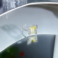 Macro detail of silver twist band ring featuring yellow enamel butterfly on mirror surface - Hollow Butterfly Style (JZ2505A)