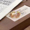 Elegant gold-plated open ring featuring pink enamel butterflies and a heart center - Adjustable Open / Pink Drip Enamel Double Butterfly Style (JZ5831)