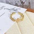 Gros plan détaillé d'une bague papillon rose vintage avec des accents de zircon brillant - Ouvert Réglable / Style Papillon Rose Texture Ondulée (JZ0201A)